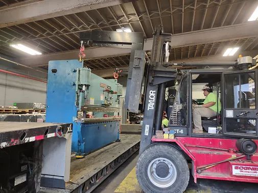 A Man is Driving a Forklift in a Warehouse | Wooster, OH | Bogner Construction Company