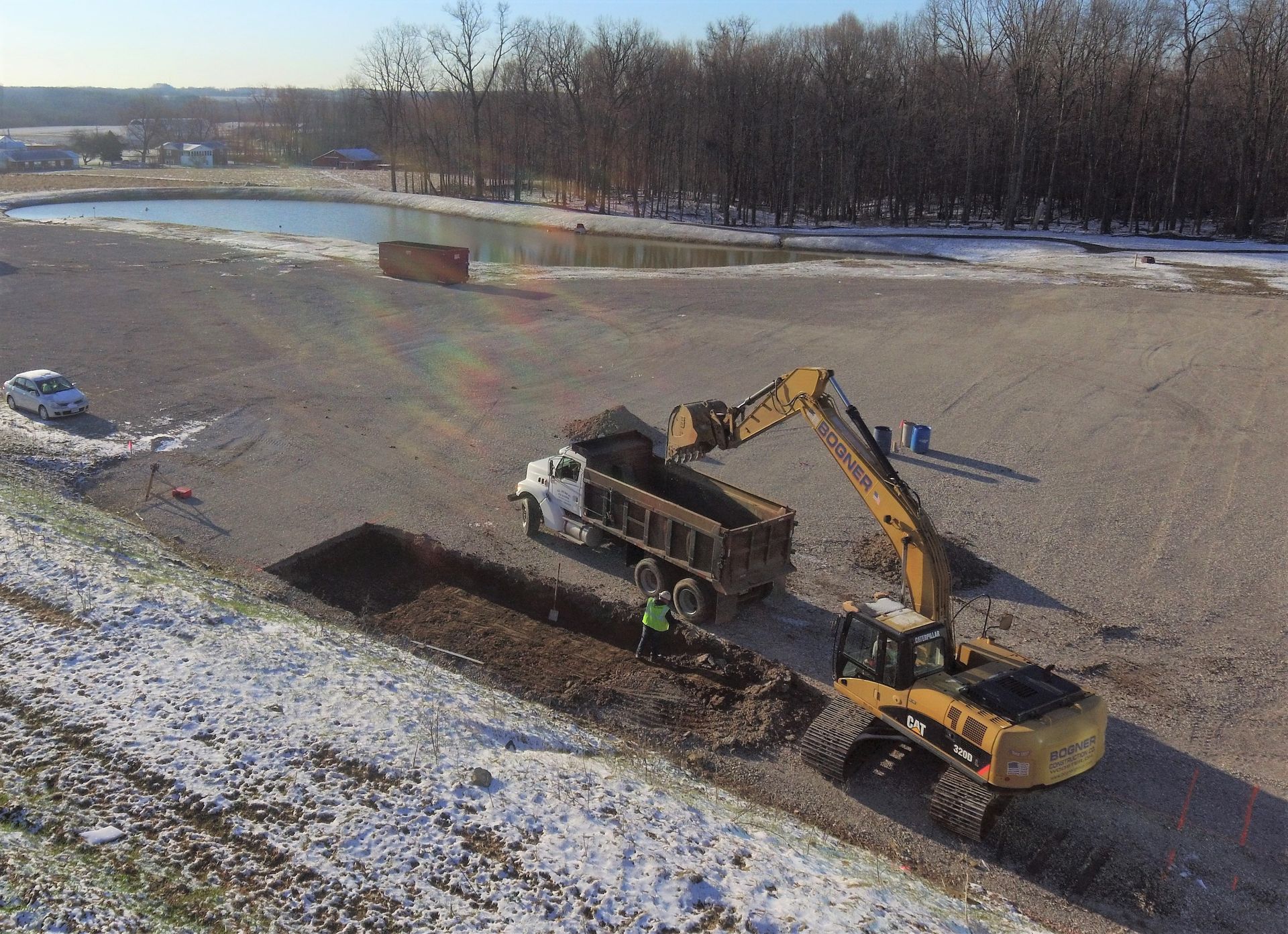 An Aerial View of a Dump Truck Being Loaded with Dirt by an Excavator | Wooster, OH | Bogner Construction Company