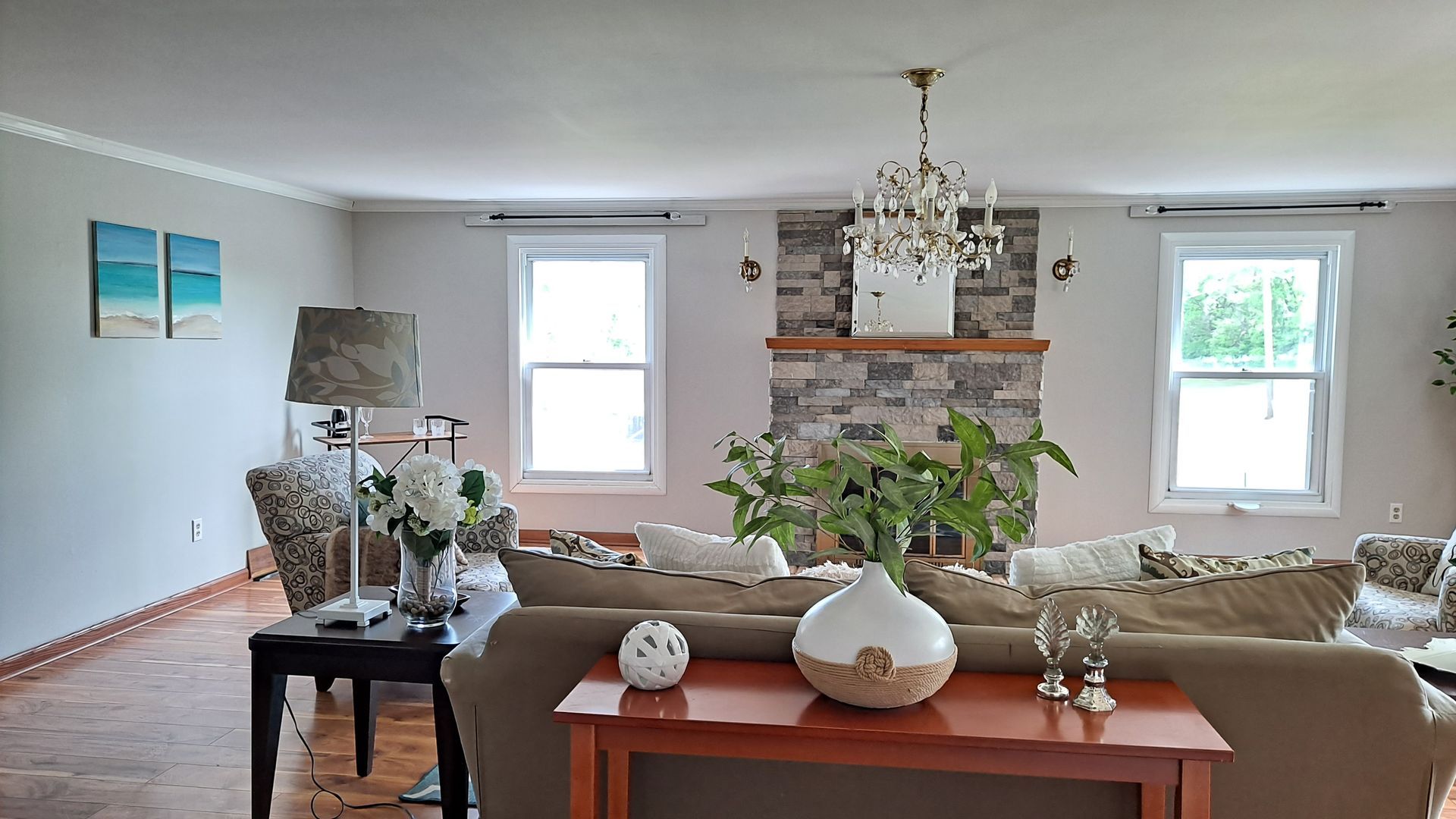 Beautiful staging of large vacant living room.