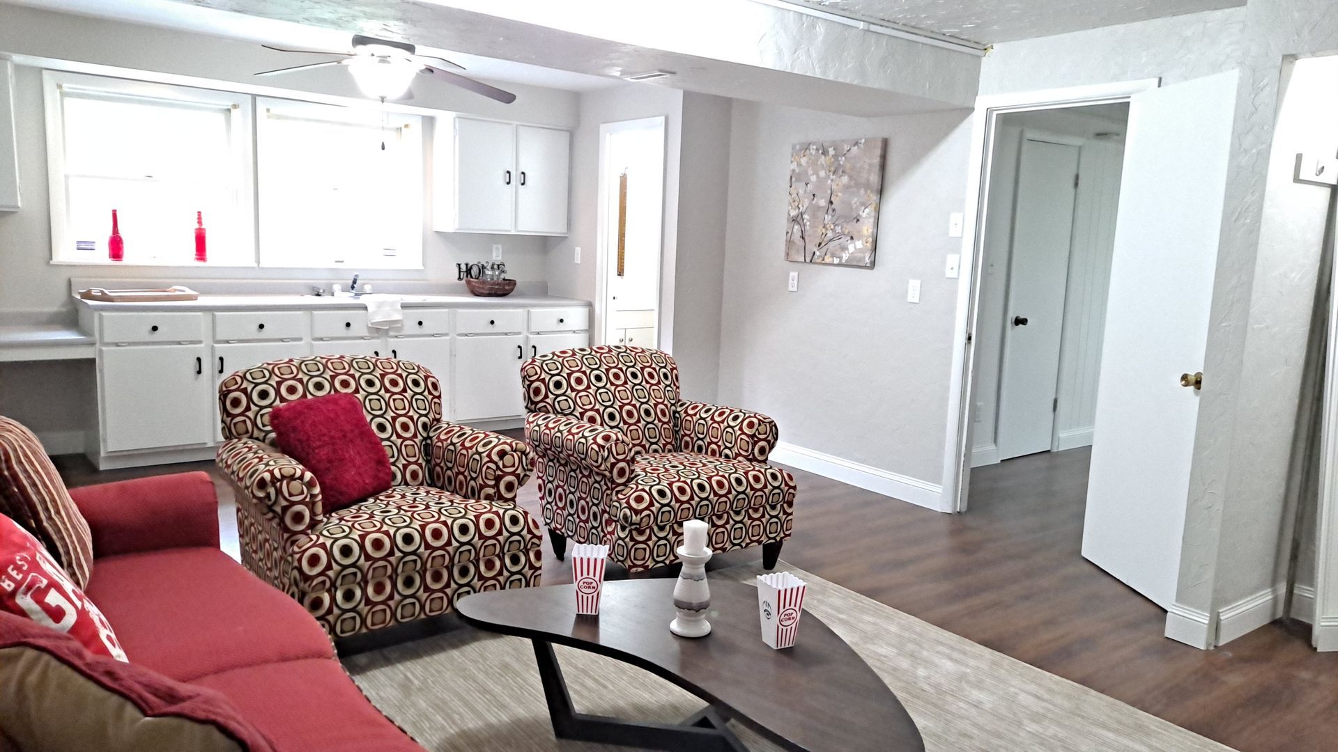 Home staging for a game room can be as simple as using bright colors and adding a few popcorn containers or gaming items.