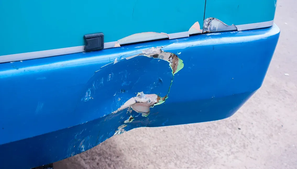 A Damaged Rear Bumper on a Passenger Bus — Dentmaster Refinishing In Bungalow, QLD