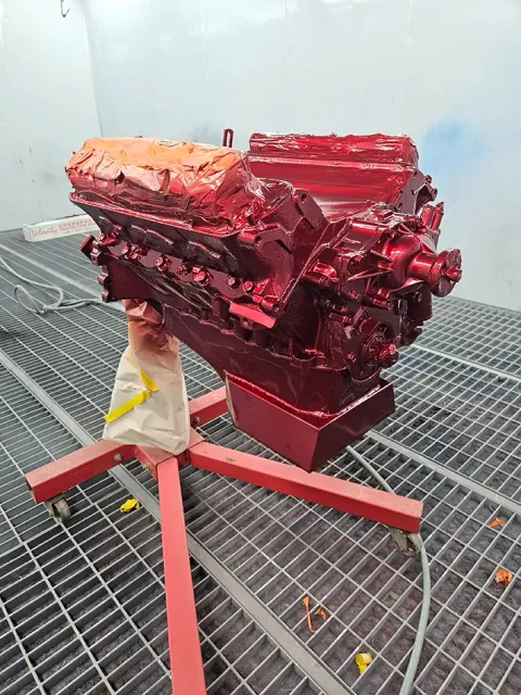 An Engine Being Spray Painted in a Spray Booth — Dentmaster Refinishing In Bungalow, QLD