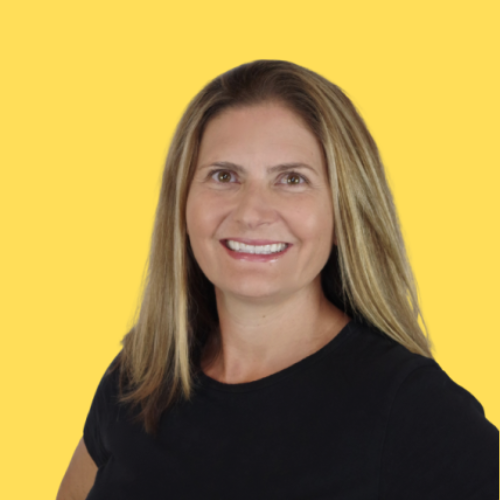 Woman smiling, wearing a black shirt, set against a yellow background.