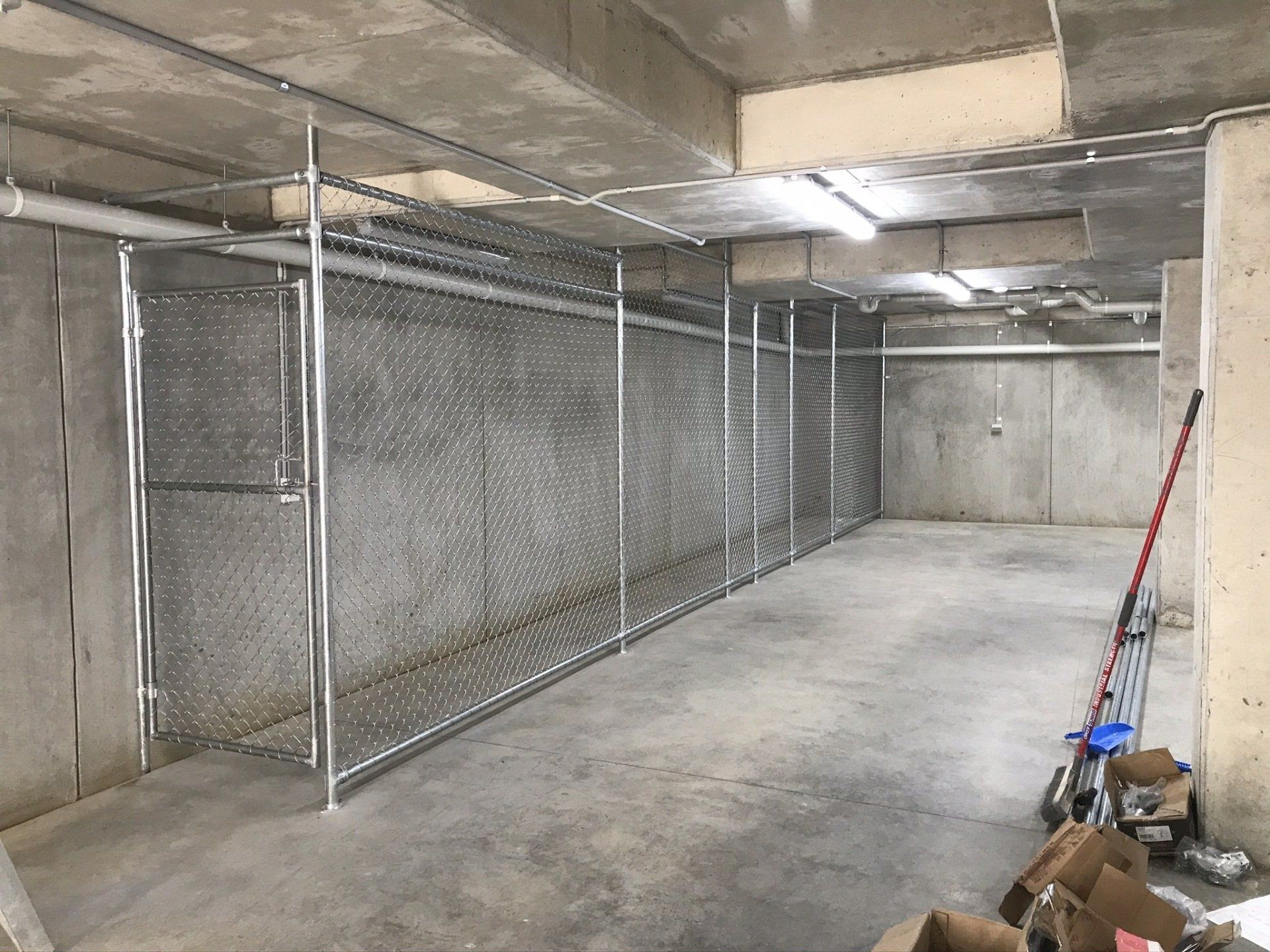 Long chain mesh storage cage in a basement
