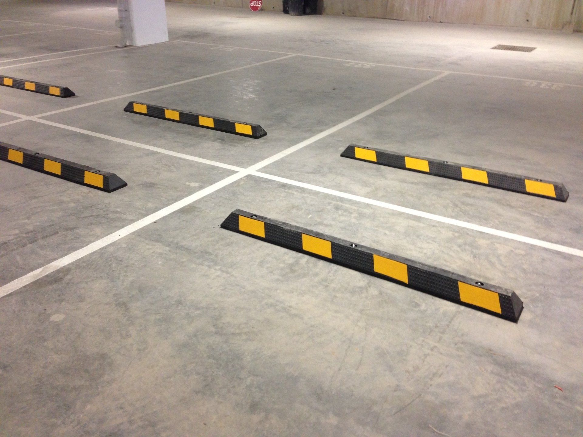 Stainless steel bollards, one large and one small next to each other