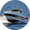A boat is floating on top of a body of water.