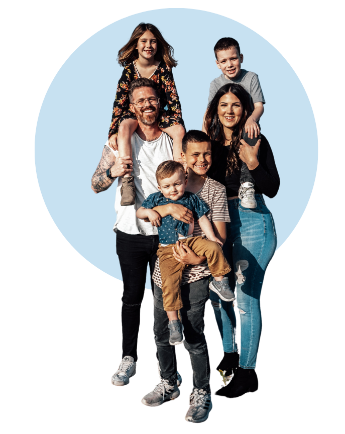 A family is posing for a picture together in a blue circle.