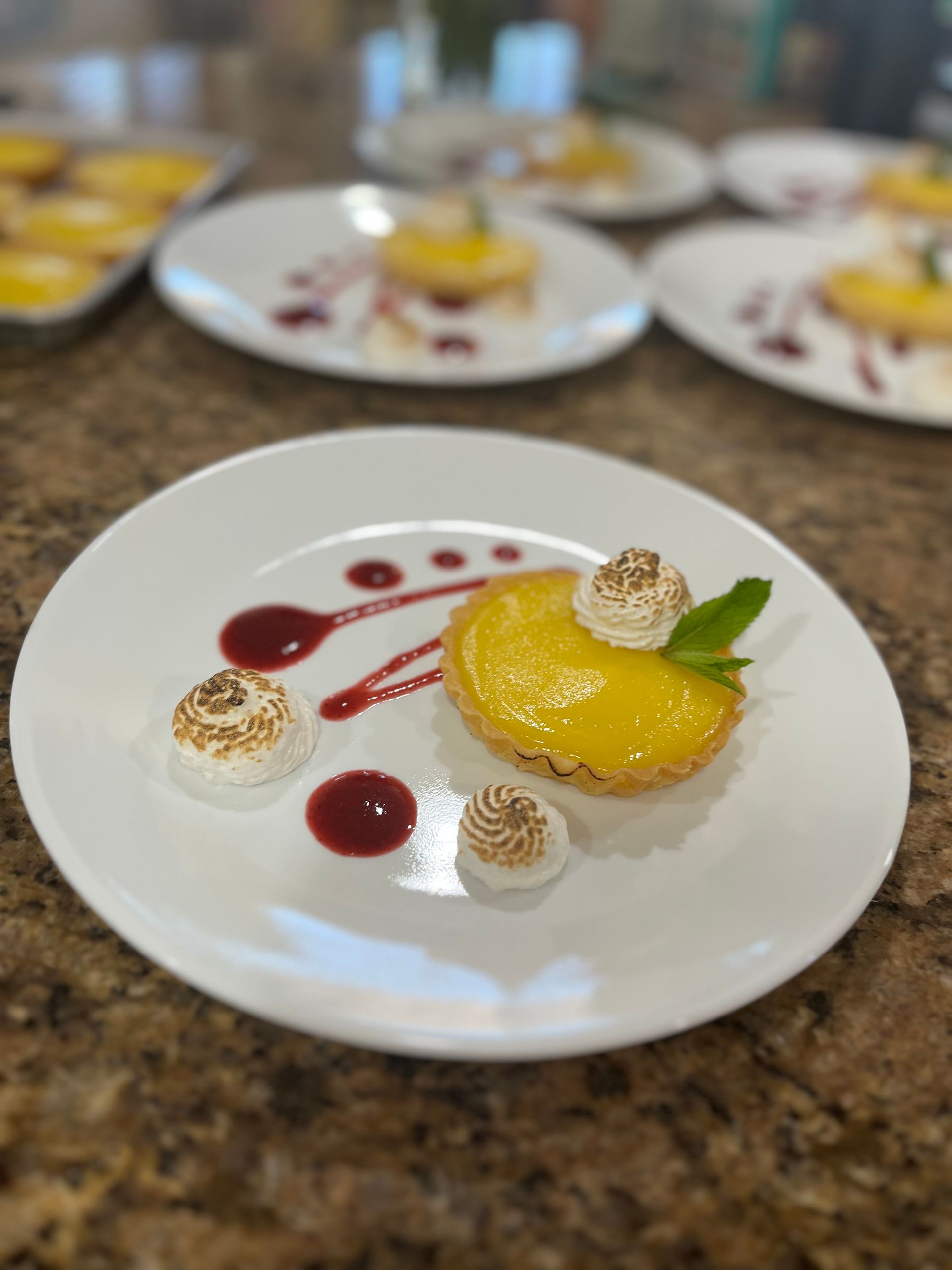 Lemon Tart with Mixed Berry Coulis, and Toasted Swiss Meringue