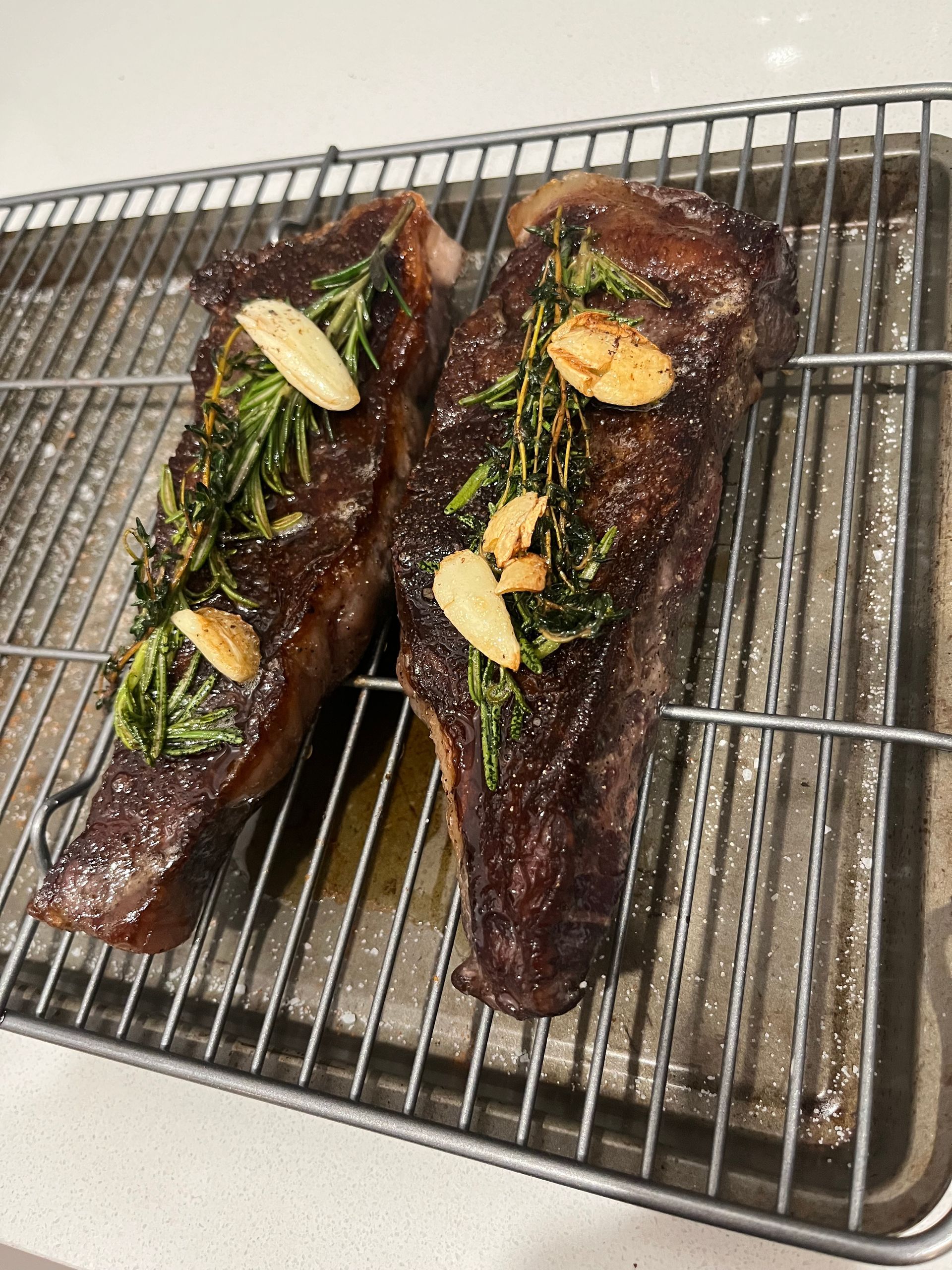 New York Strips Resting after being basted