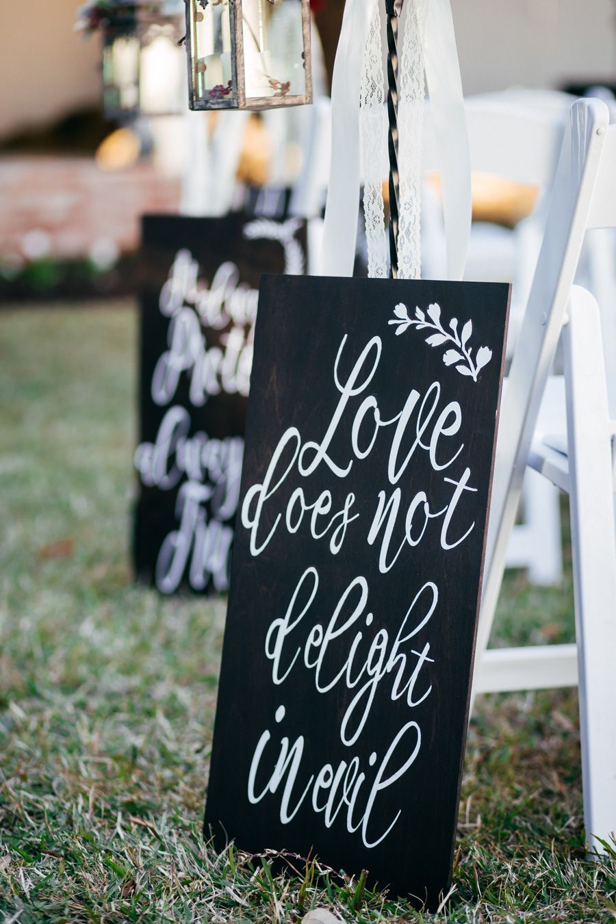 Black chalkboard sign with white calligraphy: 