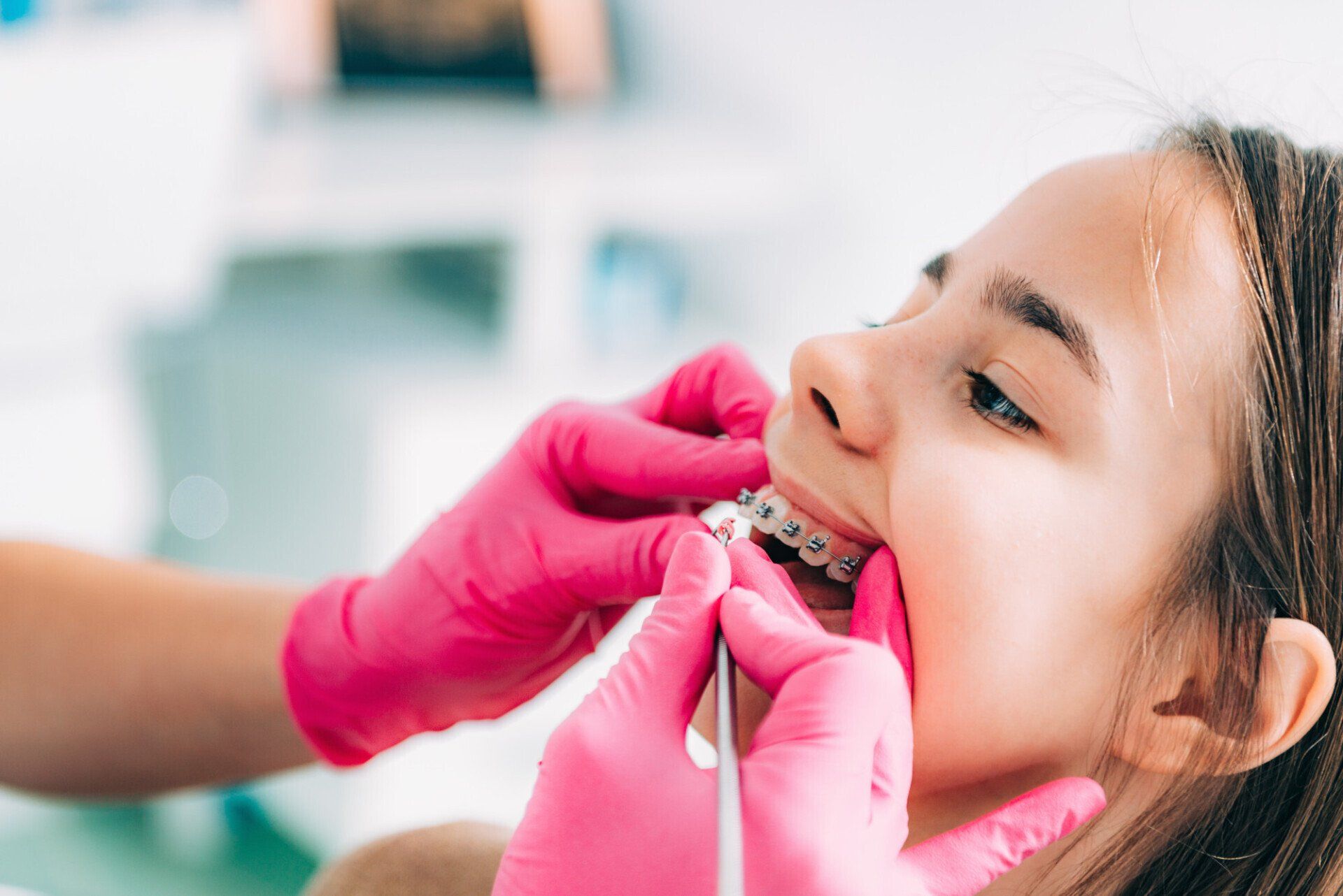 dentist checking girl mouth