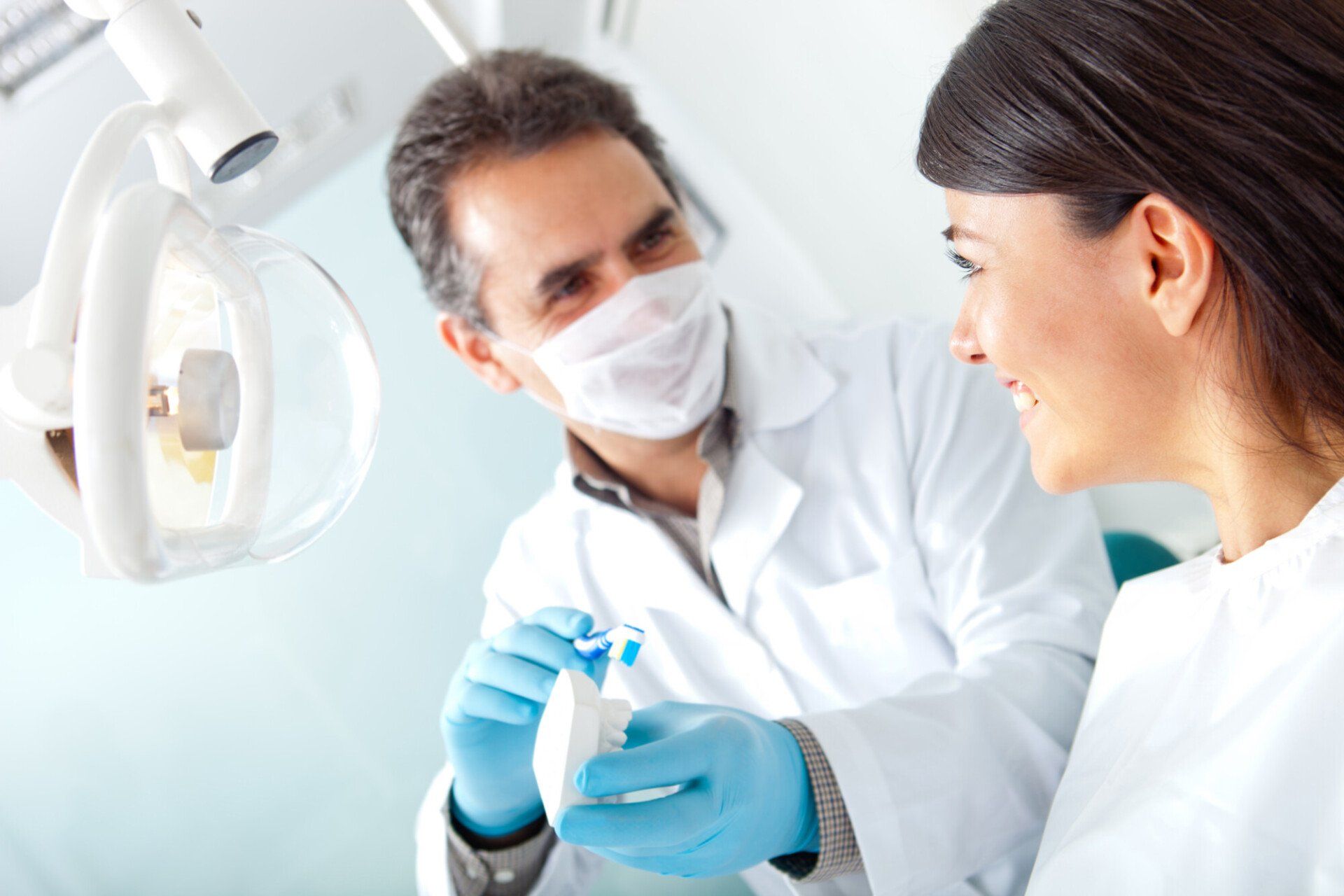 Dentist attending to dental patient