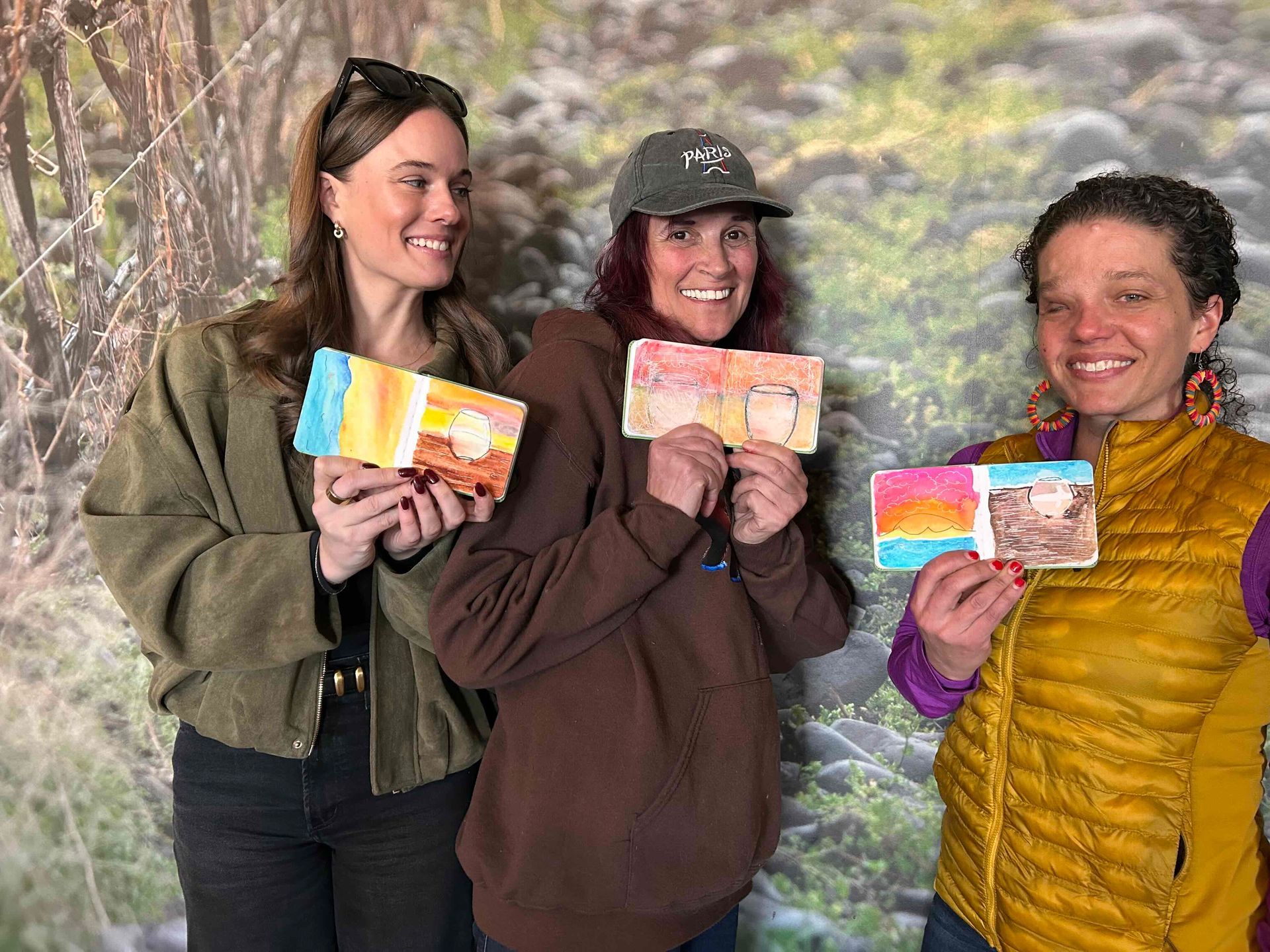 3 woman holding art journals