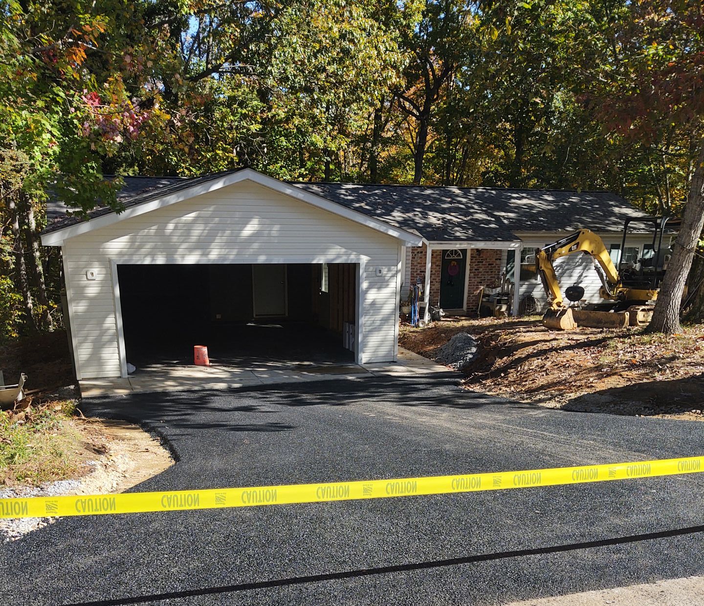 front of house, garage addition being completed