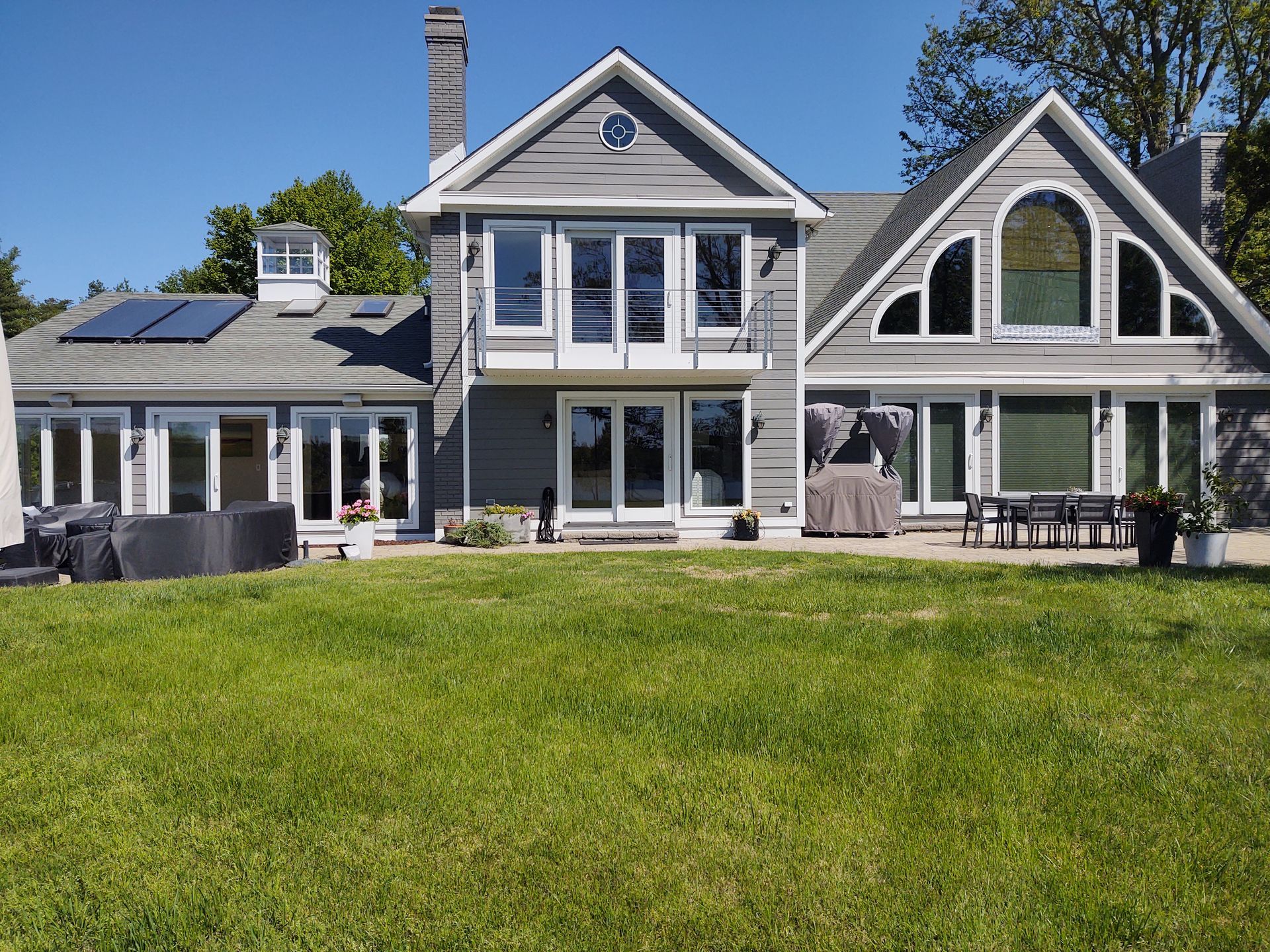 A large house with a large lawn in front of it
