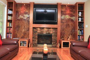 A living room with a fireplace and a flat screen tv