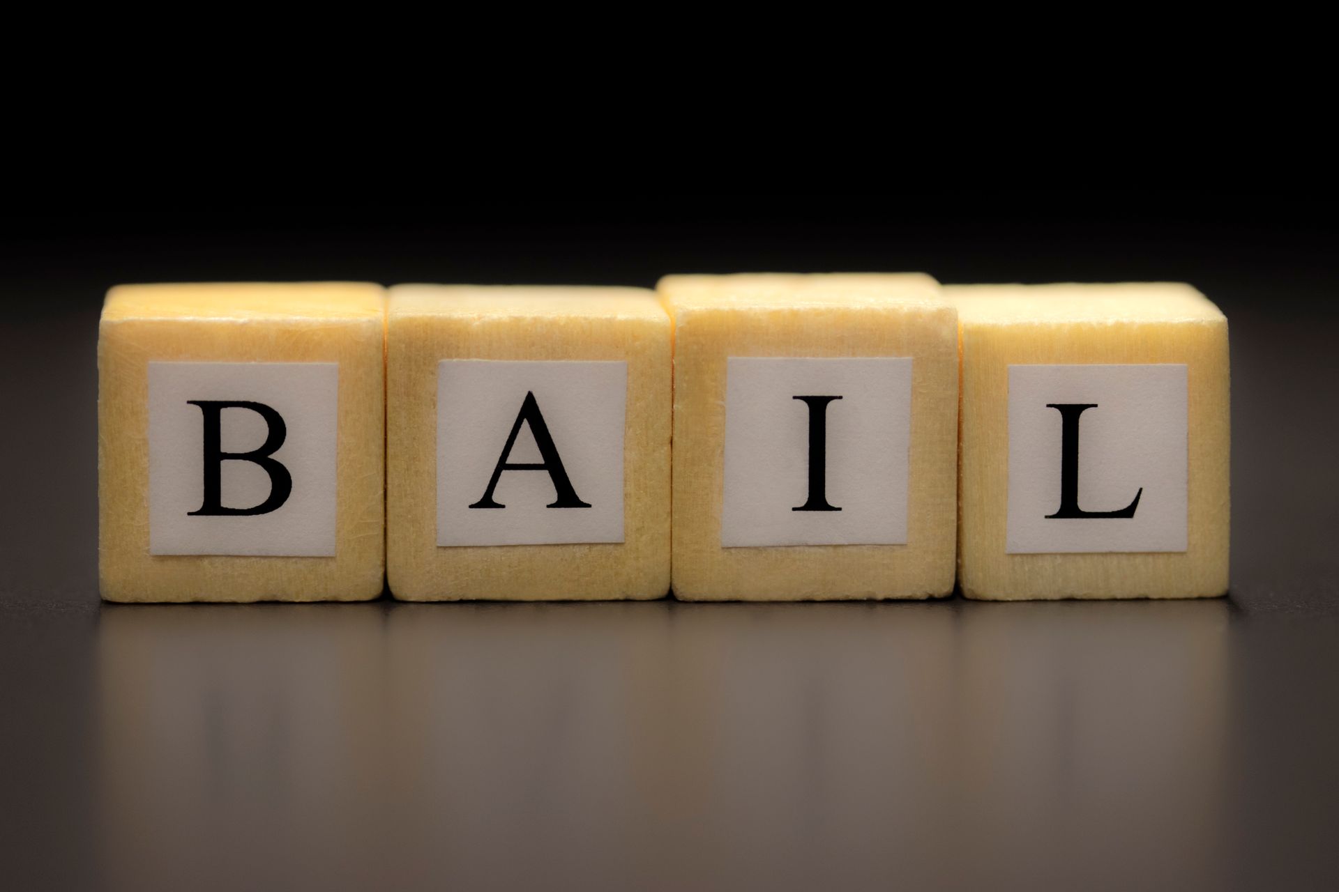 The word bail is written on a set of blocks