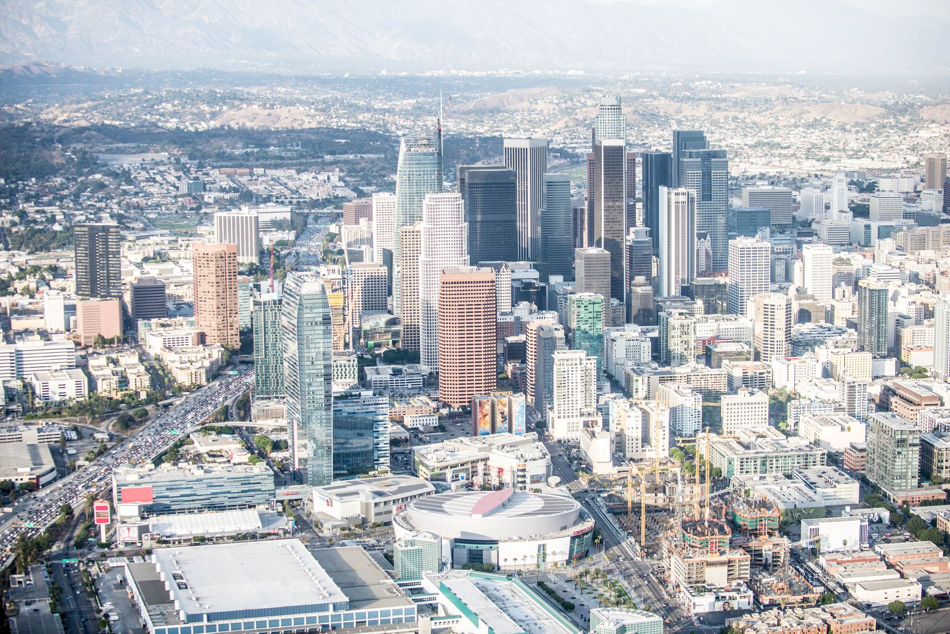 An aerial view of a city with lots of tall buildings