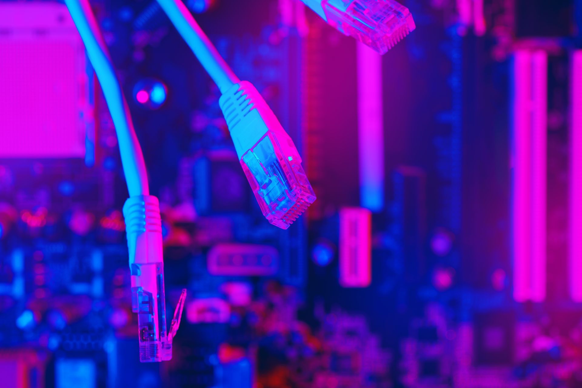 A bunch of ethernet cables are connected to a motherboard.