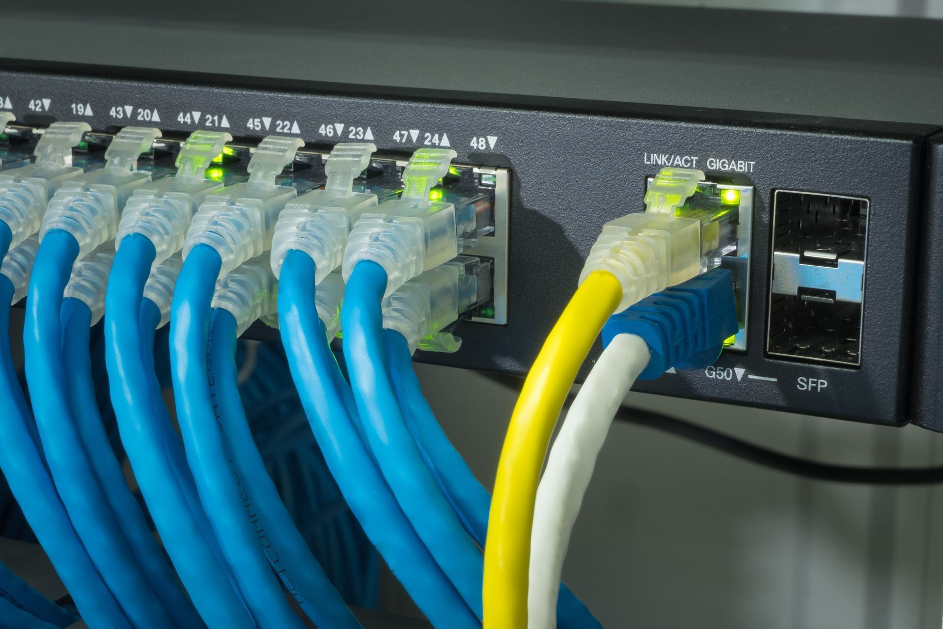 A bunch of wires are connected to a router