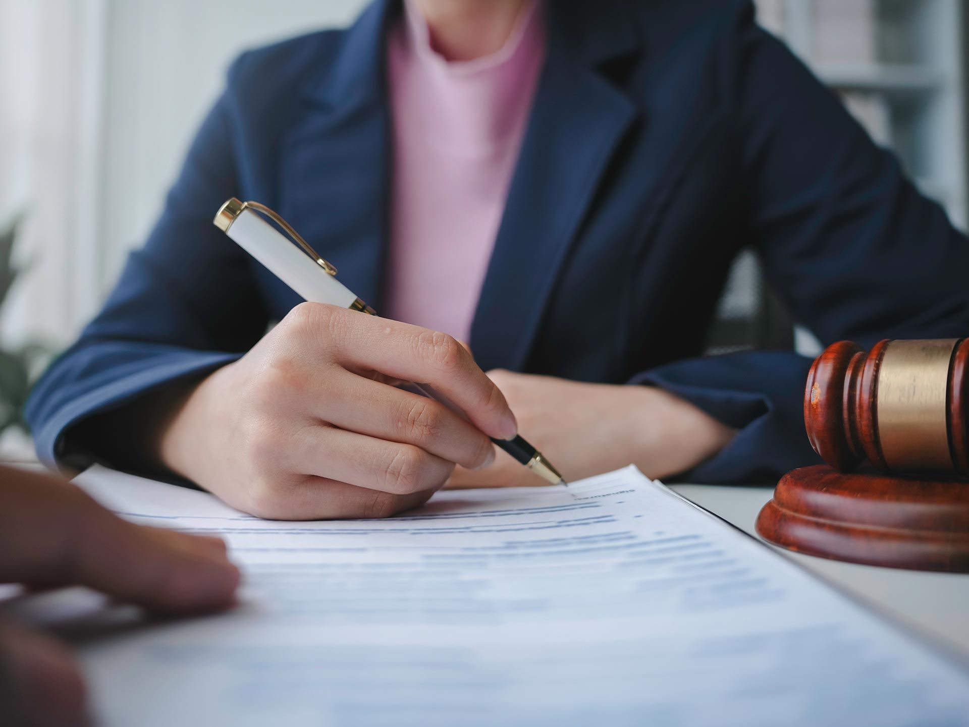 Lawyer signing a last will and testament