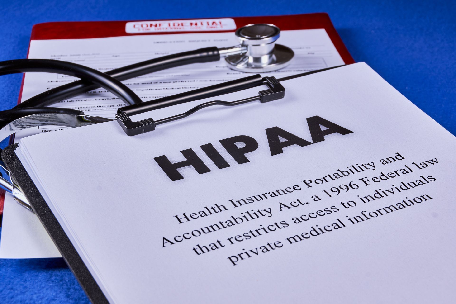 A clipboard with the word hipaa on it