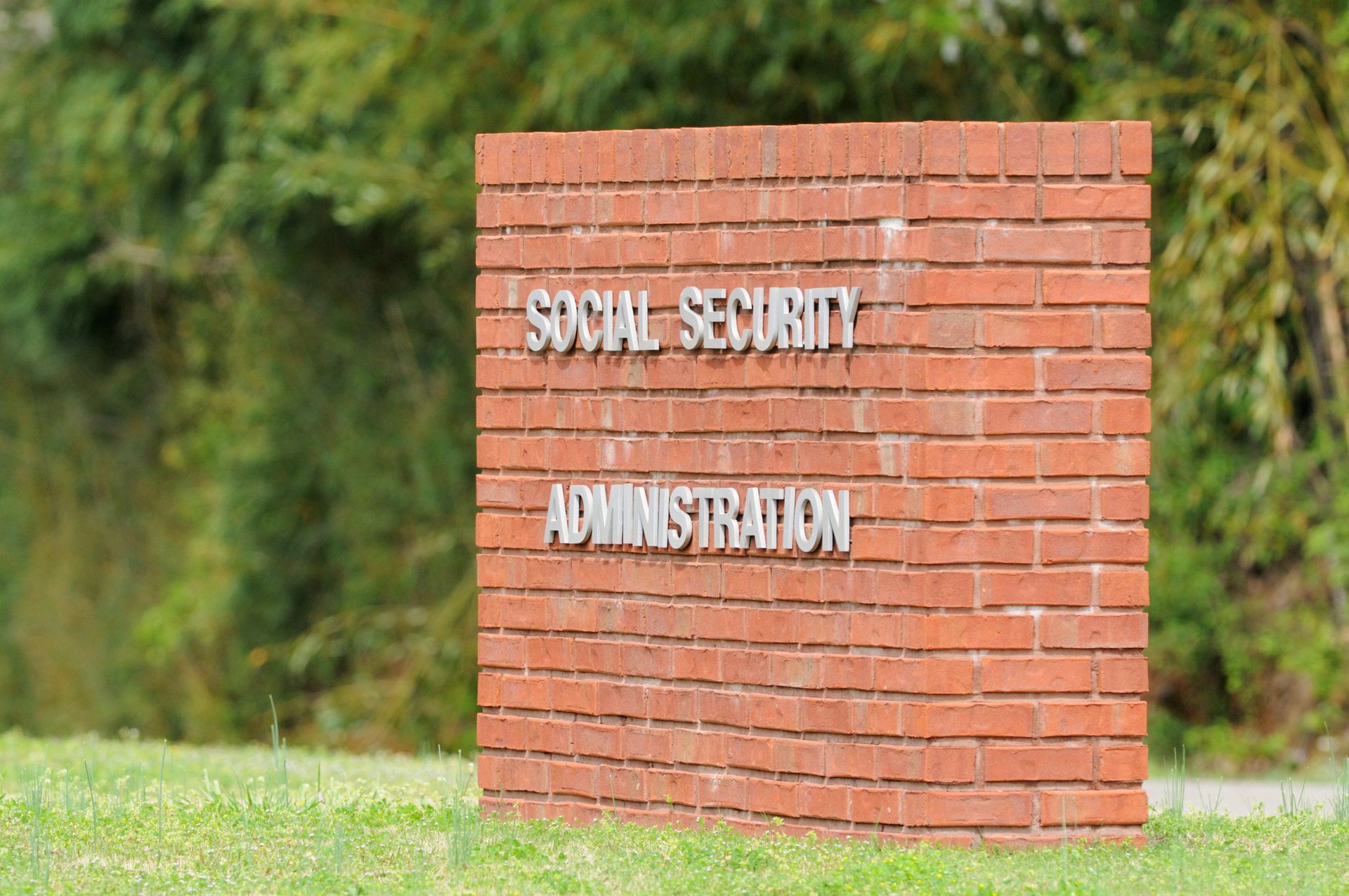 A brick wall with the words social security administration written on it