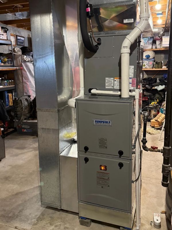 Residential Tempstar furnace connected to HVAC ductwork in a basement.