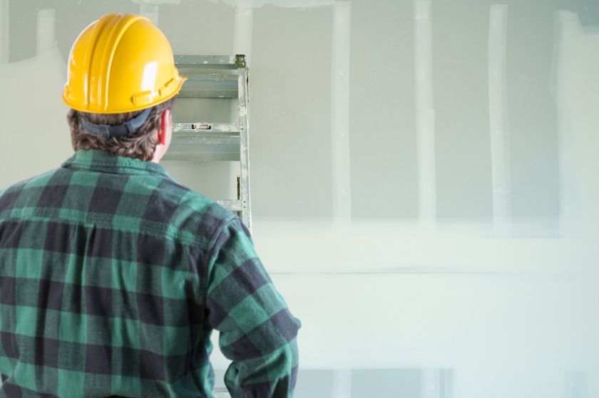 man looking at the wall