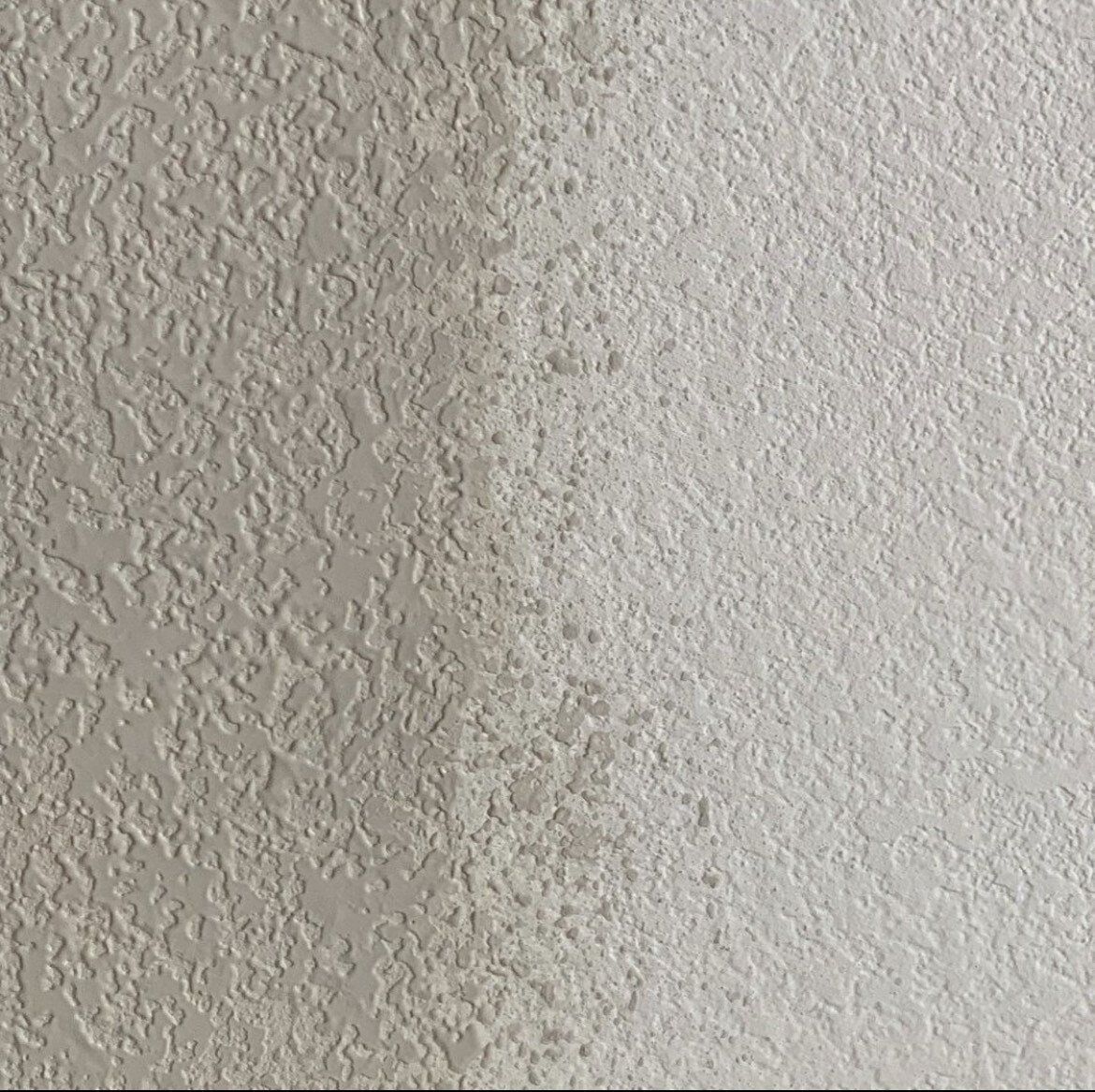 worker scraping the wall
