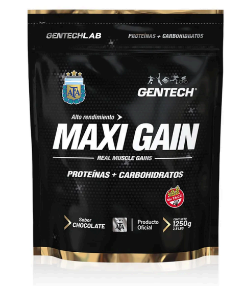 Bolsa de suplemento Max Gain en negro y dorado con el texto “proteínas + carbohidratos” y etiqueta con sabor a chocolate.