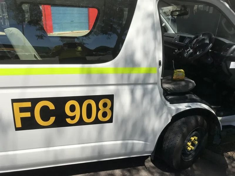 White Van With Black and Yellow Markings, Displaying