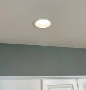 A smooth, freshly painted ceiling after popcorn removal.