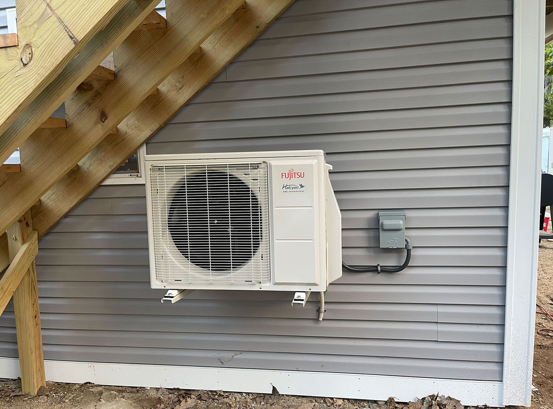 Heat pump installed on the side of a home