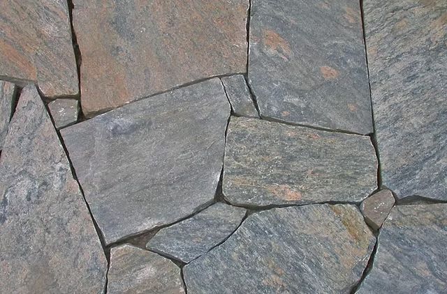 Gray stone patio stone and flagstone of irregular muskoka rock slate pieces