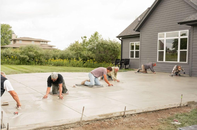 Crew finishes a newly poured backyard patio during Concrete Services in Chico, CA for a smooth outdoor living space now.