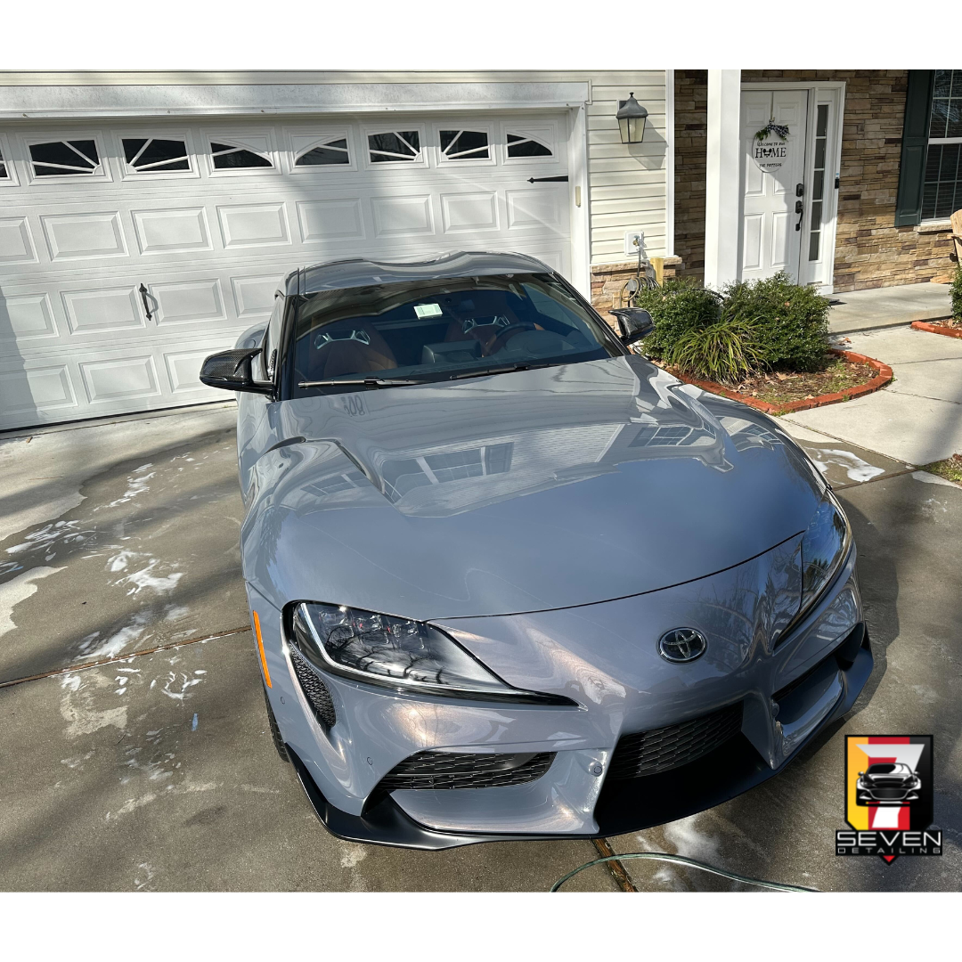 A gray, Toyota, SUV detailed by a mobile detailing company.