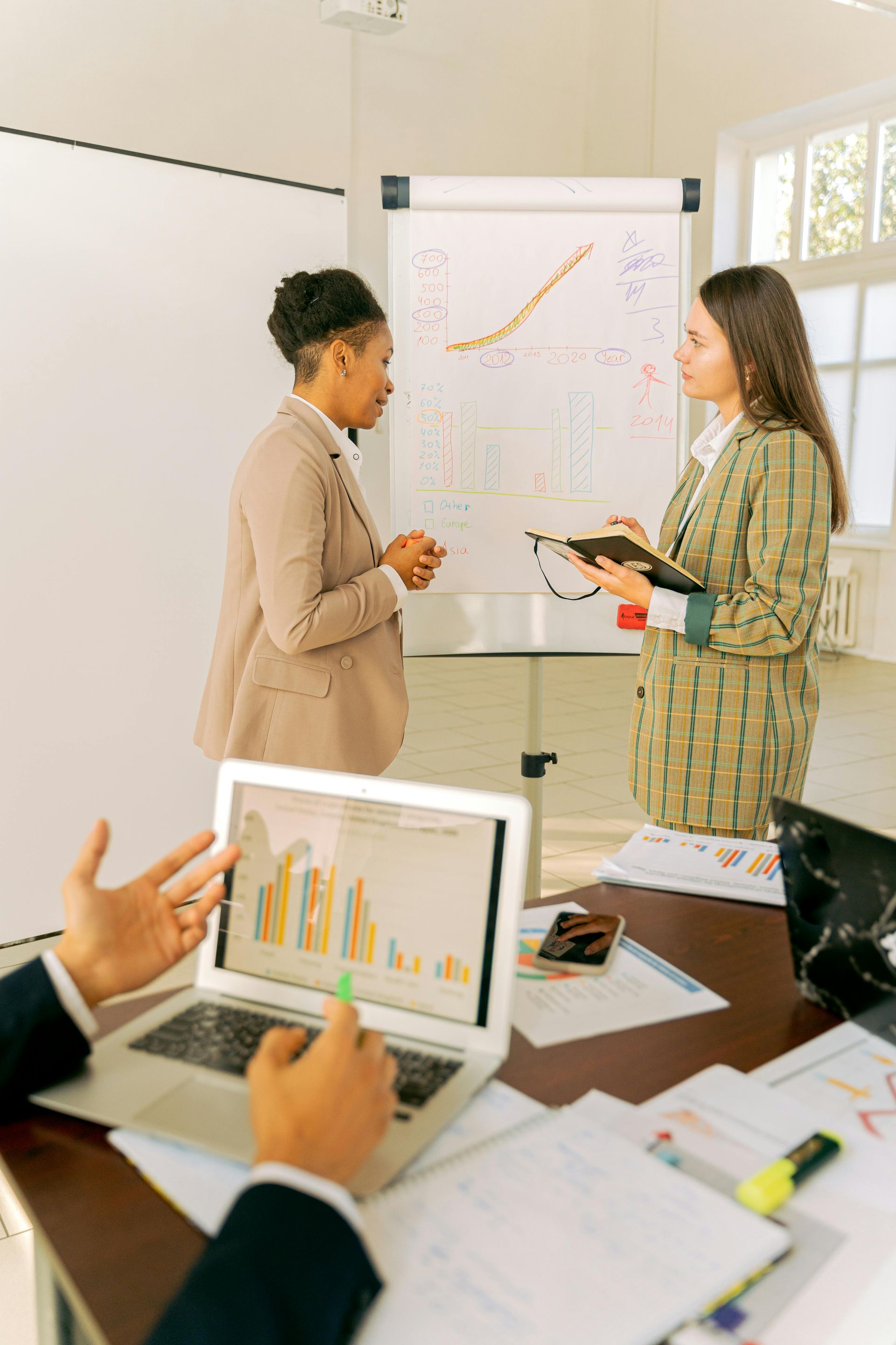 A group of people are having a meeting in a conference room.