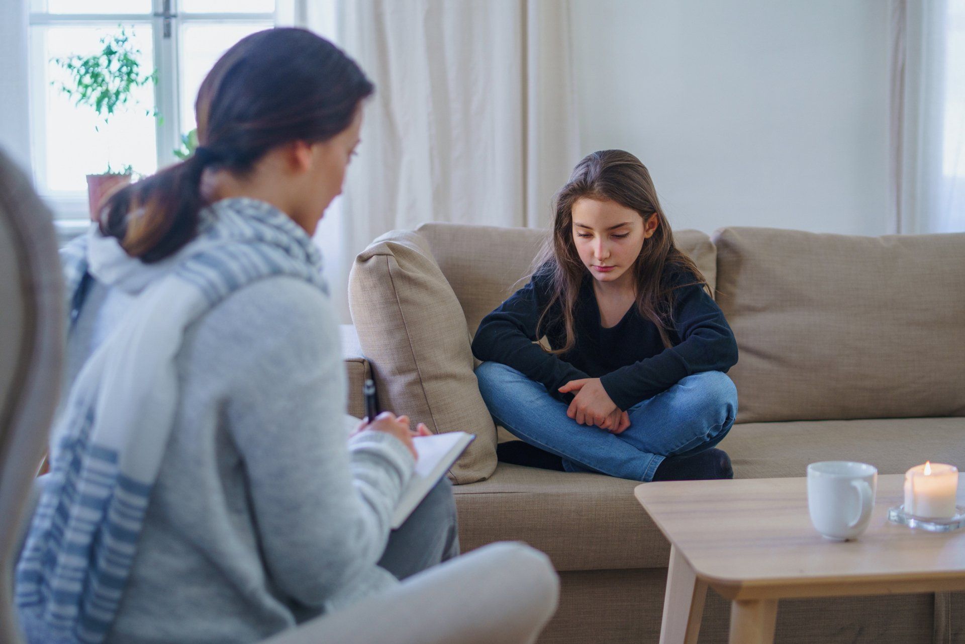 Depressed Girl with Therapist Indoors – Anchorage, AK – Counseling Solutions Of Alaska LLC