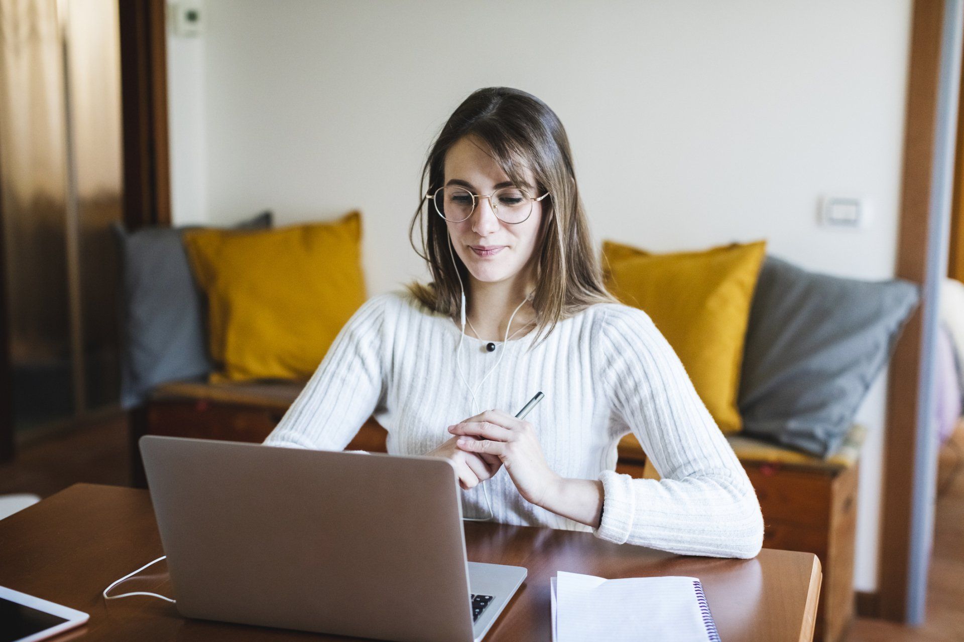 Woman Listening on Laptop – Anchorage, AK – Counseling Solutions Of Alaska LLC