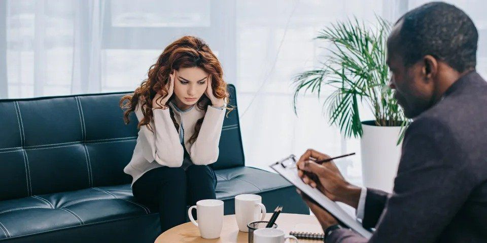 Stressed Woman Talking to Male Counselor – Anchorage, AK – Counseling Solutions of Alaksa LLC