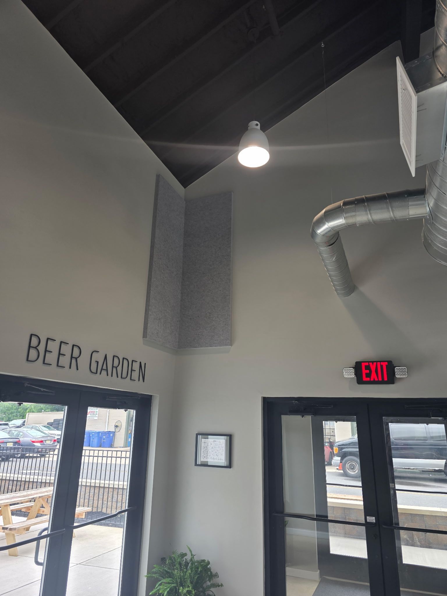 Interior of a Beer Garden, featuring gray walls, an 