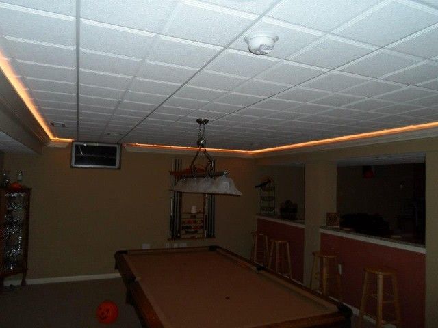 Game room with pool table, recessed lighting, and a bar area.