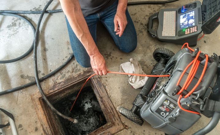 Plumber Fixing Sink — Victoria, TX — Arnold’s Plumbing & Reroute Service Plumber Fixing Sink — Victoria, TX — Arnold’s Plumbing & Reroute Service