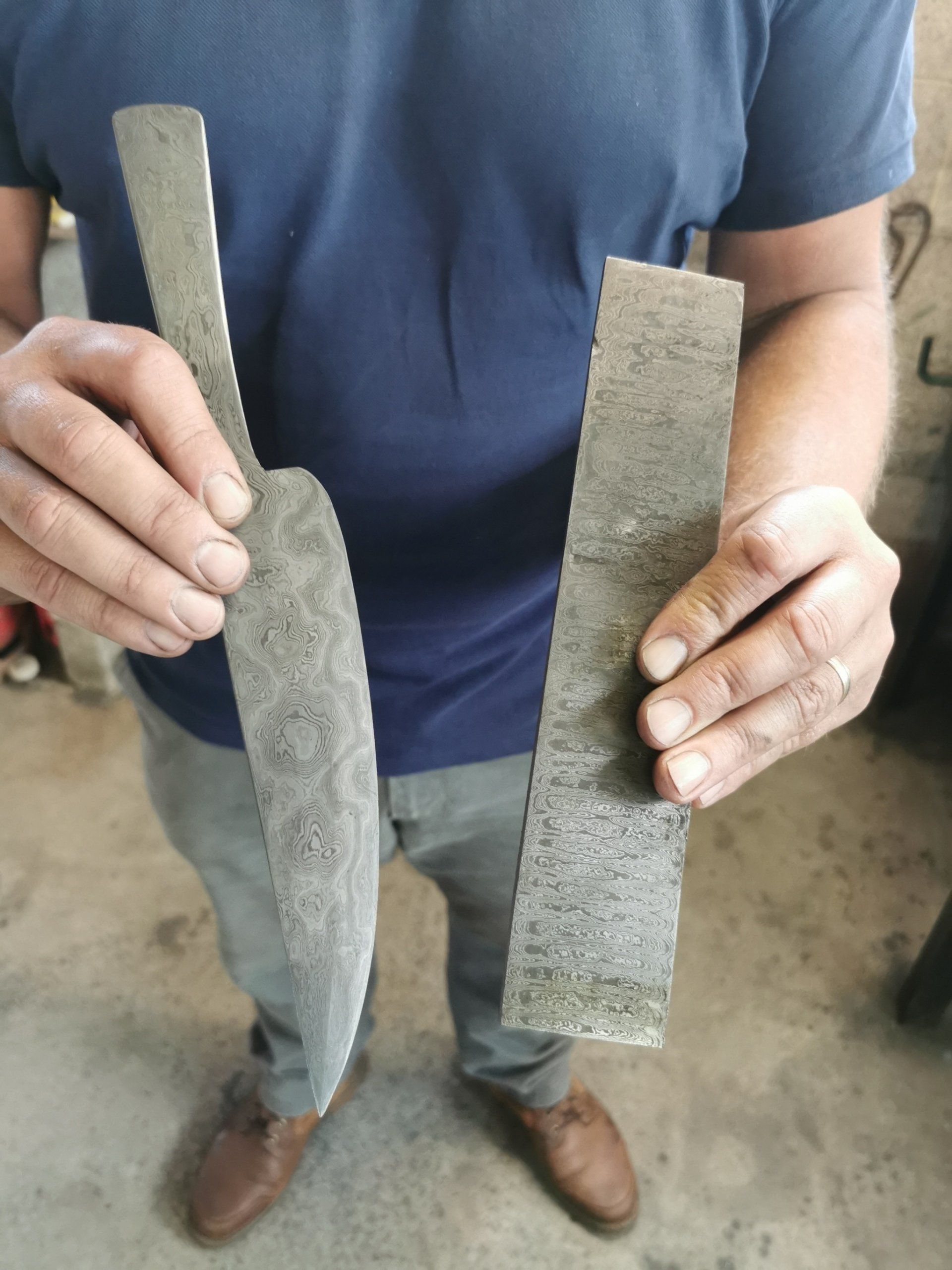 blacksmith student holding metal work