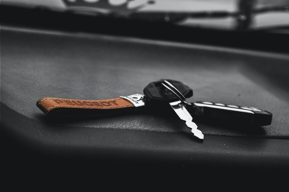 Key at car chair — Locksmith in Robina, QLD