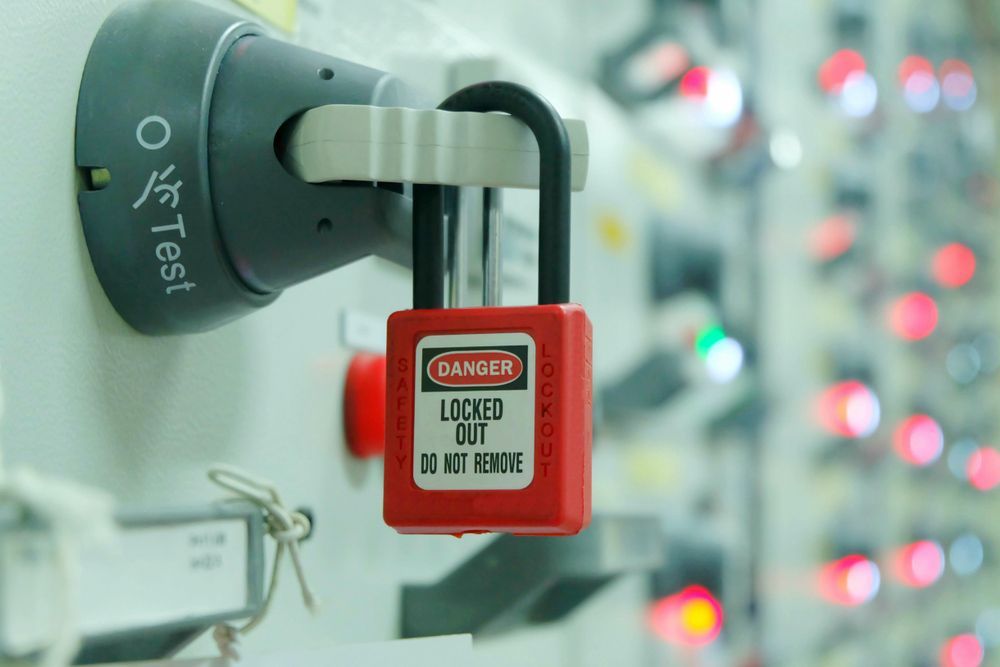 Red key lock and white tag for process cut off electrical on control panel in substation — Locksmith in Clear Island Waters, QLD