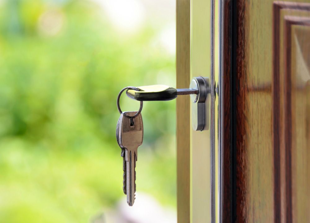 Locksmith in workshop makes new key — Locksmith in Southport, QLD