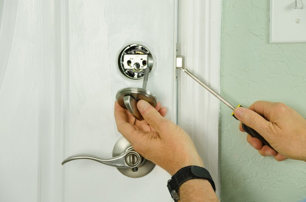 Locksmith Installing a New Deadbolt Lock on a House in Mermaid Beach, QLD