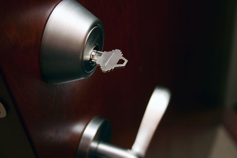 Double deadlocked brown wooden door — Locksmith in Merrimac, QLD